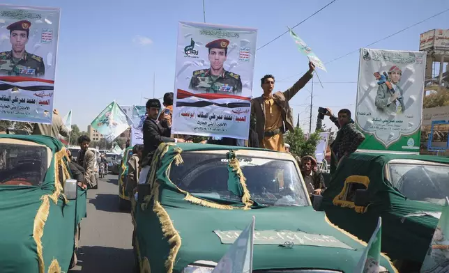 Pickup trucks travel in a mass funeral procession for Houthi officers and other military personnel in Sanaa, Yemen, Wednesday, Sept. 16, 2026. (AP Photo)