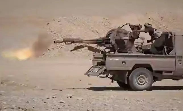 This image taken from an undated video released Tuesday, Sept. 15, 2026, by the Ansar Allah Media Office, the media arm of Yemen's Houthi rebels, shows what the group says are Houthi fighters firing a weapon mounted on a pickup truck during combat with Saudi-backed forces in eastern Jawf, Yemen. (Ansar Allah Media Office via AP)
