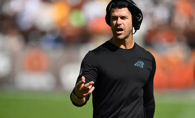 Carolina Panthers head coach Dave Canales motions towards the field against the Cleveland Browns during the first half of an NFL football game in Cleveland, Sunday, Sept. 27, 2026. (AP Photo/David Richard)