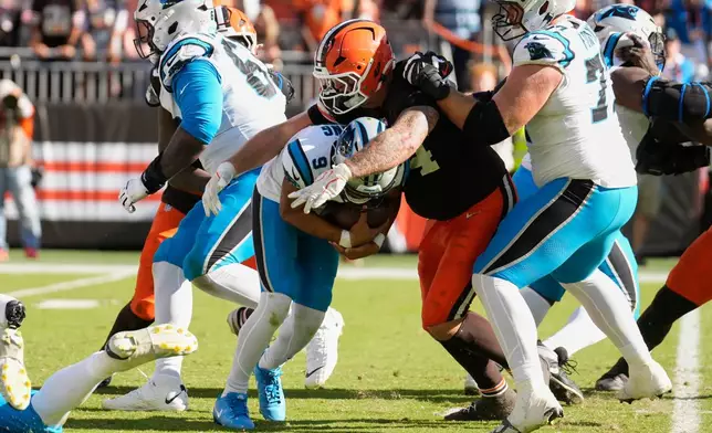Cleveland Browns defensive tackle Mason Graham (94) sacks Carolina Panthers quarterback Bryce Young (9) during the second half of an NFL football game in Cleveland, Thursday, Aug. 27, 2026. (AP Photo/Sue Ogrocki)