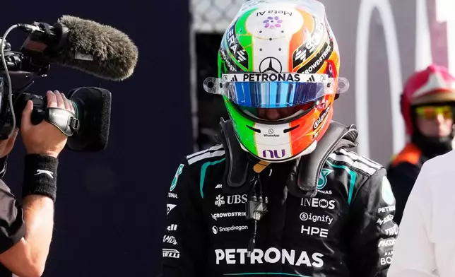 Mercedes driver Andrea Kimi Antonelli of Italy walks through the pits after the qualifying session ahead of the Italian Formula One Grand Prix, in Monza, Italy, Saturday, Sept. 5, 2026. (AP Photo/Luca Bruno)