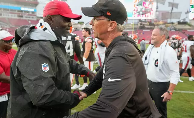 Tampa Bay Buccaneers head coach Todd Bowles, left, and Cleveland Browns head coach Todd Monken meet at the end of an NFL football game in Tampa, Fla., Sunday, Sept. 20, 2026. (AP Photo/Chris O'Meara)