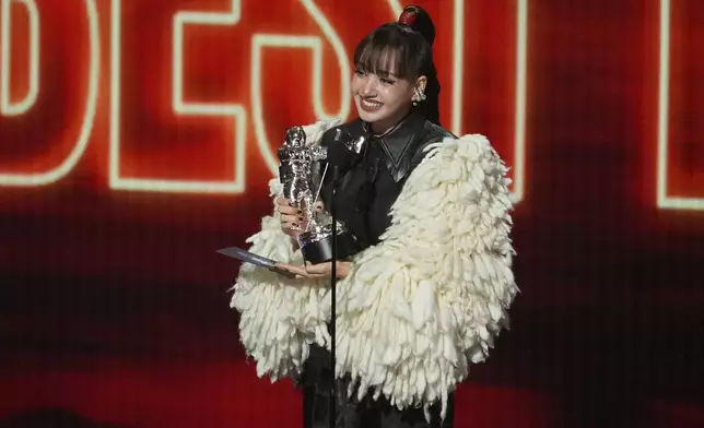 Lisa accepts the award for best pop for "Dream feat. Kentara Sakaguchi" during the MTV Video Music Awards on Sunday, Sept. 27, 2026, at the Peacock Theater in Los Angeles. (AP Photo/Chris Pizzello)