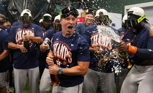 Houston Astros manager Joe Espada celebrates after defeating the Athletics 9-0 to win the American League West after a baseball game at Sutter Health Park in West Sacramento, Calif., Sunday, Sept. 27, 2026. (Jason Fochtman/Houston Chronicle via AP)