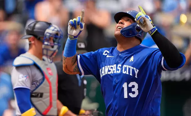 Kansas City Royals' Salvador Perez celebrates as he crosses the plate after hitting a two-run home run during the third inning of a baseball game against the Toronto Blue Jays, Sunday, Sept. 6, 2026, in Kansas City, Mo. (AP Photo/Charlie Riedel)