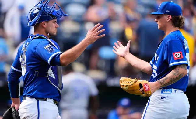 Kansas City Royals' Nolan Hoffman, right, and Luke Maile celebrate after their baseball game against the Kansas City Royals, Sunday, Sept. 6, 2026, in Kansas City, Mo. (AP Photo/Charlie Riedel)