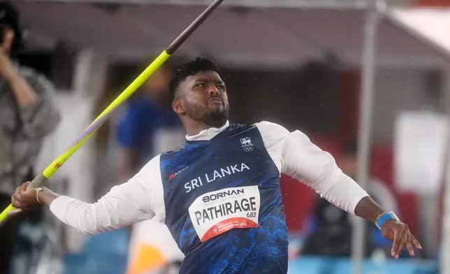 Sri Lanka's Rumesh Pathirage competes in the men's javelin throw final at the Asian Games in Nagoya, Japan, Monday, Sept. 28, 2026. (AP Photo/Lee Jin-man)