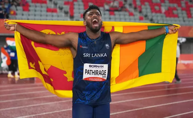 Sri Lanka's Rumesh Pathirage celebrates after winning the men's javelin throw final, at the Asian Games in Nagoya, Japan, Monday, Sept. 28, 2026. (AP Photo/Lee Jin-man)