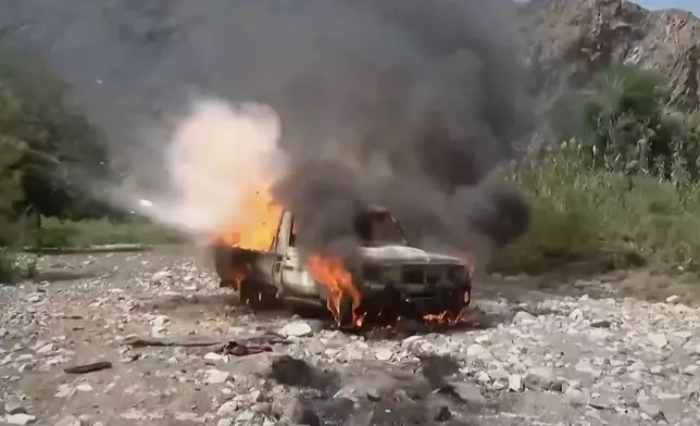 This image taken from undated video released by the Ansar Allah Media Office, the media arm of Yemen's Houthi rebels, on Saturday, Sept. 12, 2026, shows a vehicle burning during what the group says was an advance by Houthi fighters against Saudi-backed forces at an undisclosed location in southern Yemen. (Ansar Allah Media Office via AP)