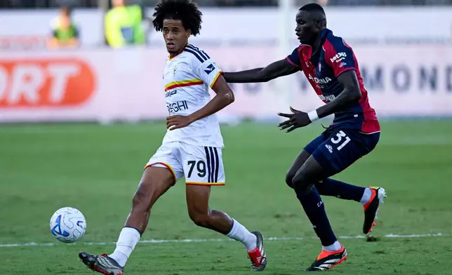 Lecce's Oumar Jacky Ngom, left, and Cagliari's Paul Mendy in action during the Serie A soccer match between Cagliari Calcio and Lecce in Cagliari, Italy, Monday Sept. 7, 2026. (Gianluca Zuddas/Lapresse via AP)