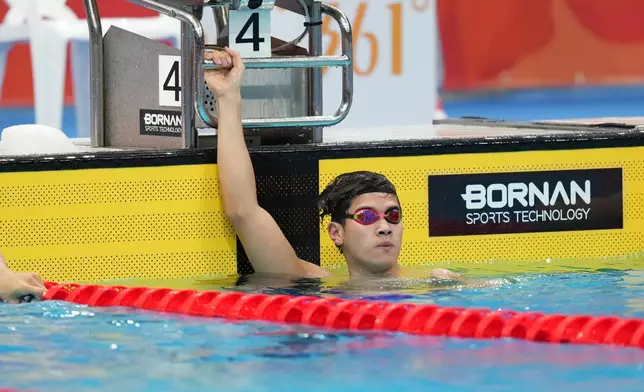 Pan Zhanle of China watches the scoreboard after competing in the men's 100-meter freestyle final in swimming at the Asian Games in Tokyo, Japan, Sunday, Sept. 20, 2026. (AP Photo/Hiro Komae)