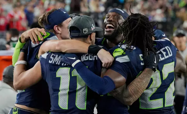 FILE - Seattle Seahawks players celebrate on the sideline late in the game against the New England Patriots during the NFL Super Bowl 60 football game, Feb. 8, 2026 in Santa Clara, Calif. (AP Photo/Doug Benc, File)