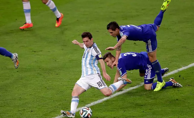 FILE - Argentina's Lionel Messi scores his team's second goal during the group F World Cup soccer match against Bosnia in Rio de Janeiro, Brazil, June 15, 2014. (AP Photo/Sergei Grits, File)