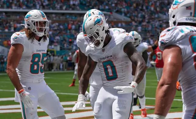 Miami Dolphins Ollie Gordon II (0) celebrates after he scores a touchdown during an NFL football game against the Kansas City Chiefs, Sunday, Sept. 27, 2026, in Miami Gardens. (AP Photo/Lynne Sladky)