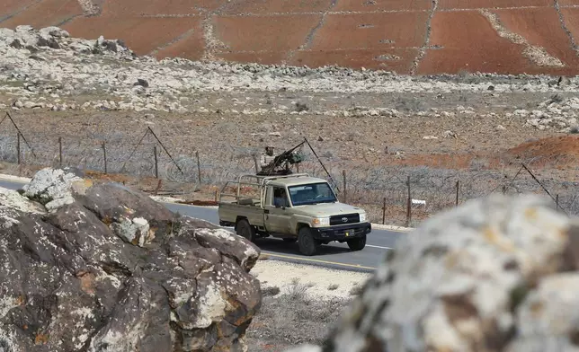 FILE - Jordanian soldiers patrol along the eastern Jordan-Syria border, in al-Washash, Mafraq governorate, Jordan, Thursday, Feb. 17, 2022, during media tour organised by the Jordanian army. (AP Photo/Raad Adayleh, File)
