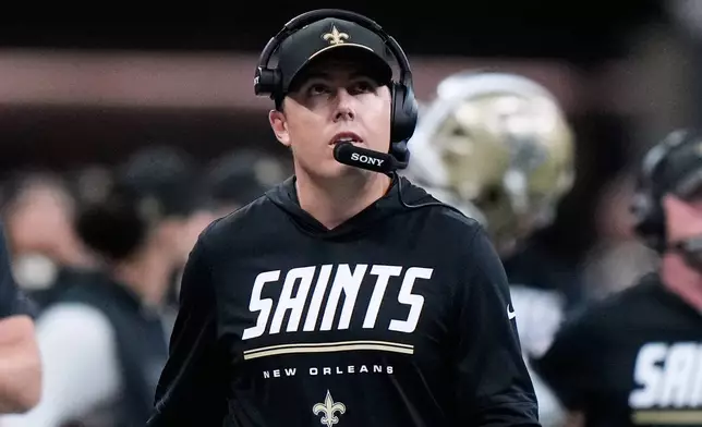 New Orleans Saints head coach Kellen Moore stands on the sideline during the first half of an NFL football game against the Las Vegas Raiders in New Orleans, Sunday, Sept. 27, 2026. (AP Photo/Gerald Herbert)