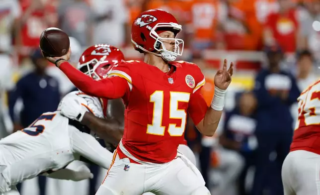 Kansas City Chiefs quarterback Patrick Mahomes throws a pass against the Denver Broncos during the first half of an NFL football game Monday, Sept. 14, 2026, in Kansas City, Mo. (AP Photo/Colin E. Braley)