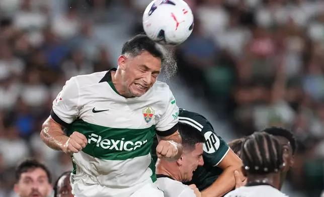 Elche's Abiel Osorio heads teh ball during the Spanish La Liga soccer match between Elche and Real Madrid in Elche, Spain, Tuesday, Sept. 15, 2026. (AP Photo/Alberto Saiz)
