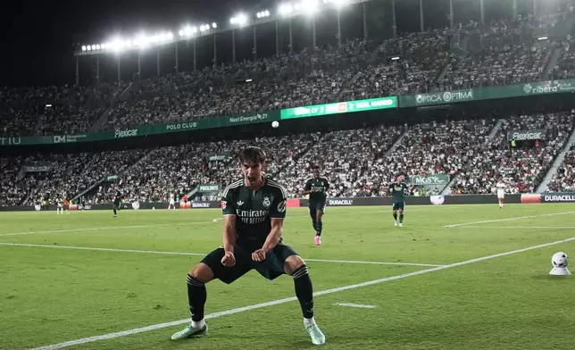 Real Madrid's Carlos Espi celebrates after scoring his sides third goal during the Spanish La Liga soccer match between Elche and Real Madrid in Elche, Spain, Tuesday, Sept. 15, 2026. (AP Photo/Alberto Saiz)