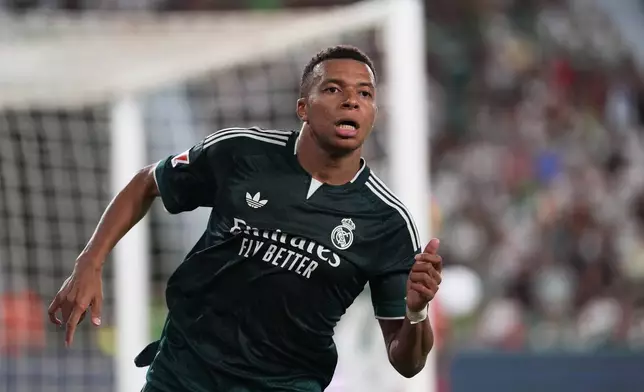 Real Madrid's Kylian Mbappe runs on the pitch during the Spanish La Liga soccer match between Elche and Real Madrid in Elche, Spain, Tuesday, Sept. 15, 2026. (AP Photo/Alberto Saiz)