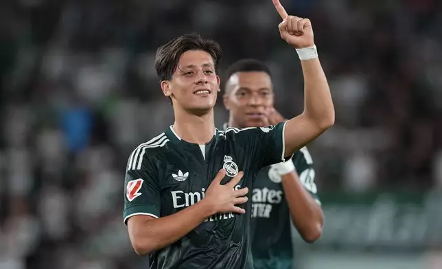 Real Madrid's Arda Guler celebrates after scoring his sides first goal during the Spanish La Liga soccer match between Elche and Real Madrid in Elche, Spain, Tuesday, Sept. 15, 2026. (AP Photo/Alberto Saiz)