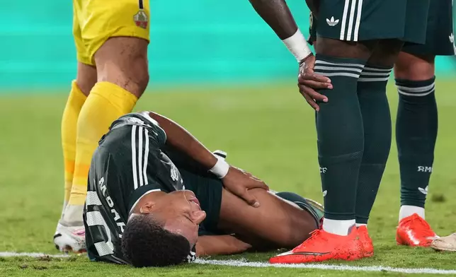 Real Madrid's Kylian Mbappe reacts after suffering an injury during the Spanish La Liga soccer match between Elche and Real Madrid in Elche, Spain, Tuesday, Sept. 15, 2026. (AP Photo/Alberto Saiz)