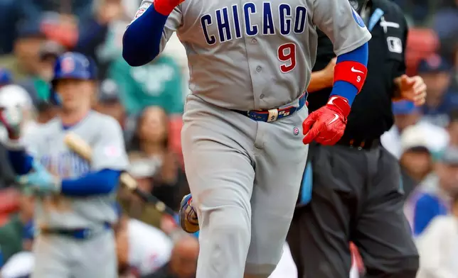 Chicago Cubs' Miguel Amaya reacts on his way to first base after getting hit by a pitch during the seventh inning of the first baseball game of a doubleheader against the Boston Red Sox, Friday, Sept. 25, 2026, in Boston. (AP Photo/Greg M. Cooper)