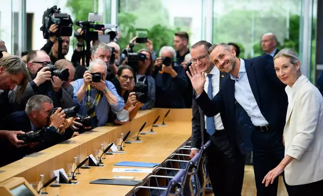 Co-leaders of Alternative for Germany party, or AfD, Alice Weidel, right, and Tino Chrupalla, left, and top candidate for the Saxony-Anhalt state elections Ulrich Siegmund, center, attend a press conference in Berlin, Germany, Monday, Sept. 7, 2026. (Bernd von Jutrczenka/dpa via AP)