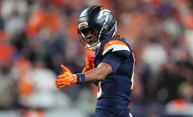 Denver Broncos wide receiver Pat Bryant gestures after a catch against the Los Angeles Rams during the second half of an NFL football game Sunday, Sept. 27, 2026, in Denver. (AP Photo/David Zalubowski)