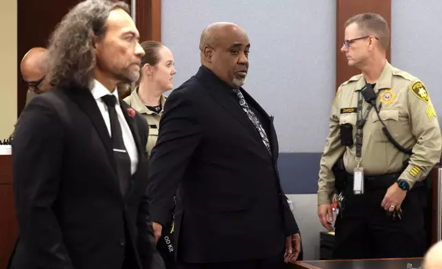 Duane Davis, center, and his attorney Michael Sanft are led back to a courtroom to hear his sentencing date after a jury found Davis guilty of first-degree murder in his trial related to the 1996 killing of rapper Tupac Shakur, at Clark County District Court Regional Justice Center, Monday, Aug. 31, 2026, in Las Vegas. (Bizuayehu Tesfaye/Las Vegas Review-Journal via AP, Pool)