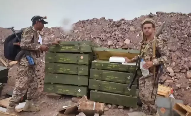 This image taken from undated video released by the Ansar Allah Media Office, the media arm of Yemen's Houthi rebels, on Saturday, Sept. 12, 2026, shows Houthi fighters inspecting what the group says is an abandoned position during their advance against Saudi-backed forces at an undisclosed location in southern Yemen. (Ansar Allah Media Office via AP)