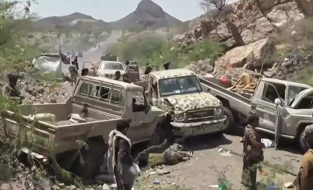 This image taken from undated video released by the Ansar Allah Media Office, the media arm of Yemen's Houthi rebels, on Saturday, Sept. 12, 2026, shows, according to the group, Houthi fighters among vehicles abandoned by Saudi-backed forces during a Houthi advance at an undisclosed location in southern Yemen. (Ansar Allah Media Office via AP)