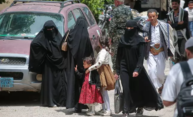 People walk at a street in Sanaa, Yemen, Sunday, Sept. 13, 2026. (AP Photo/Osamah Abdulrahman)
