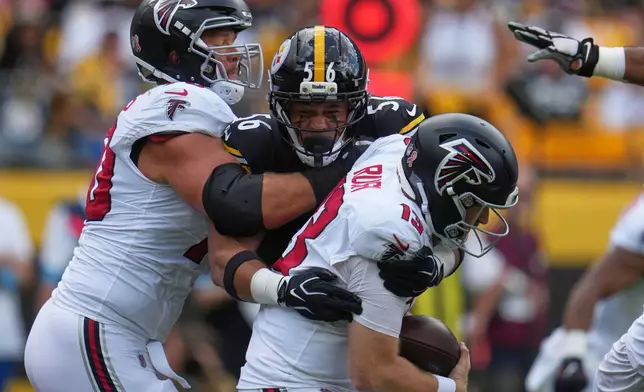 Atlanta Falcons quarterback Cooper Rush (13) is sacked by Pittsburgh Steelers linebacker Alex Highsmith (56) during an NFL football game Sunday, Sept. 13, 2026, in Pittsburgh. (AP Photo/Gene J. Puskar)