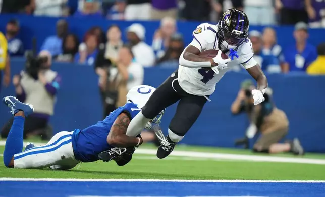 Baltimore Ravens' Zay Flowers gets past Indianapolis Colts' Charvarius Ward for a touchdown during the first half of an NFL football game Sunday, Sept. 13, 2026, in Indianapolis. (AP Photo/AJ Mast)