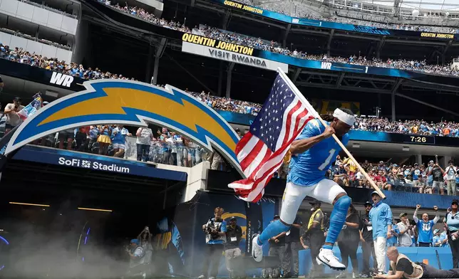 Los Angeles Chargers wide receiver Quentin Johnston is introduced before an NFL football game against the Arizona Cardinals, Sunday, Sept. 13, 2026, in Inglewood, Calif. (AP Photo/Caroline Brehman)