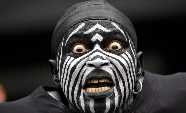 A fan reacts before an NFL football game between the Las Vegas Raiders and the Miami Dolphins, Sunday, Sept. 13, 2026, in Las Vegas. (AP Photo/David Becker)