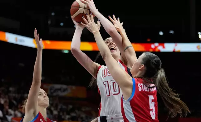 Czechia's Natalie Stoupalova guards Breanna Stewart, of the United States, during the Women's Basketball World Cup match between the United States and Czechia in Berlin, Monday, Sept. 7, 2026. (AP Photo/Ebrahim Noroozi)