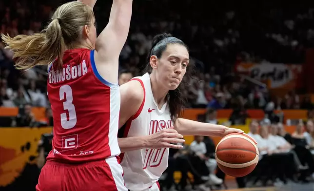 Czechia's Alena Hanusova guards Breanna Stewart, of the United States, during the Women's Basketball World Cup match between the United States and Czechia in Berlin, Monday, Sept. 7, 2026. (AP Photo/Ebrahim Noroozi)