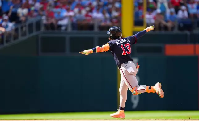 Atlanta Braves' Ronald Acuña Jr. reacts after hitting a three-run home run off Philadelphia Phillies pitcher Alex McFarlane during the eighth inning of a baseball game, Sunday, Sept. 6, 2026, in Philadelphia. (AP Photo/Derik Hamilton)