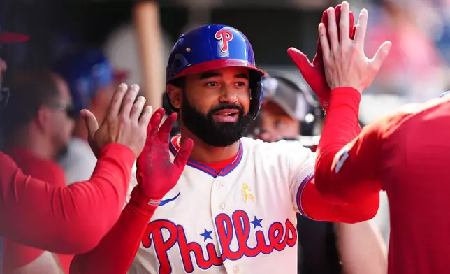 Philadelphia Phillies' Derek Hill reacts in the dugout after hitting a solo home run off Atlanta Braves pitcher Dylan Dodd during the seventh inning of a baseball game, Sunday, Sept. 6, 2026, in Philadelphia. (AP Photo/Derik Hamilton)