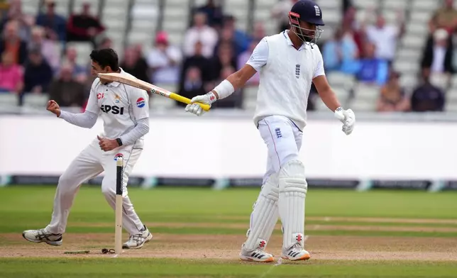 England's Emilio Gay, right, walks off the pitch after being dismissed by Pakistan's Muhammad Abbas on day four of the third cricket Test at Edgbaston, in Birmingham, England, Saturday, Sept. 12, 2026. (Mike Egerton/PA via AP)