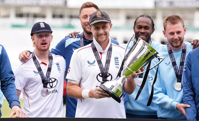 England players, including captain Joe Root, celebrate following their series win over Pakistan, on day four of the third cricket Test at Edgbaston, in Birmingham, England, Saturday, Sept. 12, 2026. (Mike Egerton/PA via AP)