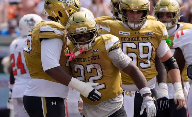 Georgia Tech running back Justice Haynes (22) celebrates his touchdown against Mercer in the first half of an NCAA college football game, Saturday, Sept. 19, 2026, in Atlanta. (AP Photo/Mike Stewart)