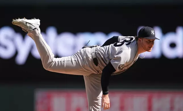 New York Yankees relief pitcher Clarke Schmidt follows through on a pitch during the seventh inning of a baseball game against the Minnesota Twins, Wednesday, Sept. 16, 2026, in Minneapolis. (AP Photo/Abbie Parr)