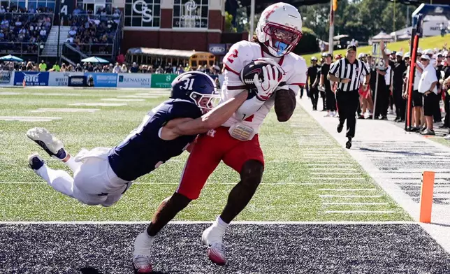 Houston wide receiver Koby Young (2) makes a touchdown catch against Georgia Southern defensive back Chance Gamble (31) in the first half of an NCAA football game, Saturday, Sept. 26, 2026, in Statesboro, Ga. (AP Photo/Mike Stewart)