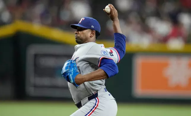 Texas Rangers starting pitcher Kumar Rocker throws against the Arizona Diamondbacks during the third inning of a baseball game, Saturday, Sept. 12, 2026, in Phoenix. (AP Photo/Ross D. Franklin)