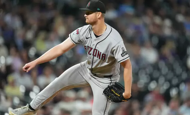 Arizona Diamondbacks starting pitcher Michael Soroka works against the Colorado Rockies in the second inning of a baseball game Tuesday, Sept. 22, 2026, in Denver. (AP Photo/David Zalubowski)
