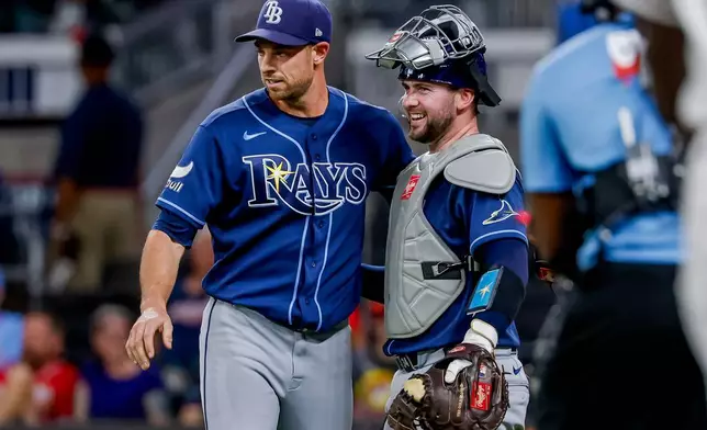 Tampa Bay Rays pitcher Steven Matz, left, celebrates with catcher Liam Hicks, right, after defeating the Atlanta Braves during the ninth inning of a baseball game, Wednesday, Sept. 9, 2026, in Atlanta. (AP Photo/Erik S. Lesser)