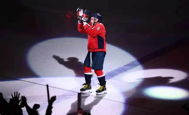 FILE - Washington Capitals left wing Alex Ovechkin reacts after he was named the first star after an NHL hockey game against the Pittsburgh Penguins, April 12, 2026, in Washington. (AP Photo/Nick Wass, File)